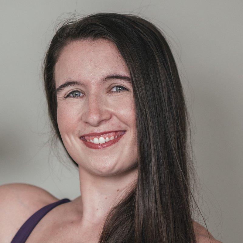 Abi, smiling and flexing her arm